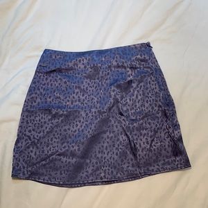 FOREVER 21 Purple Cheetah Mini Skirt with a Slit Size XS.